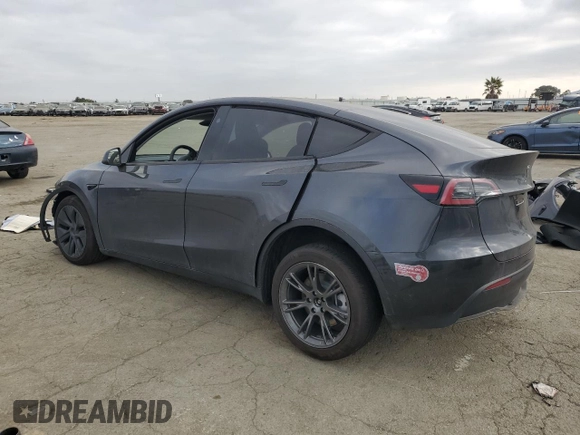 2025 Tesla Model Y Long Range with VIN 7SAYGDED6SF227475, listed as a Copart auction lot 42634345 with 3,493 mi miles and Salvage Title. Bid and sale history available at DreamBid. Image 2.
