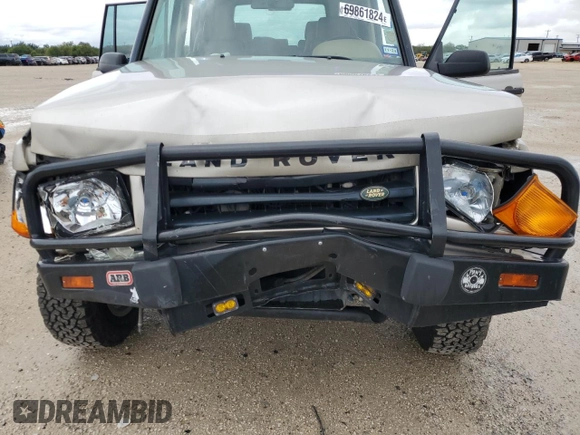 2002 Land Rover Discovery Cloth z VIN SALTY15482A752087, wystawiony jako Copart lot #69861824 z przebiegiem Nie podano mil oraz Szkoda całkowita • Salvage title. Historia ofert i sprzedaży dostępna na DreamBid. Obrazek 12.