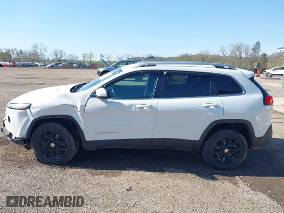 2015 Jeep Cherokee Latitude with VIN 1C4PJMCS0FW790017, listed as a IAAI auction lot 42097988 with 105,990 mi miles and . Bid and sale history available at DreamBid. Image 14.