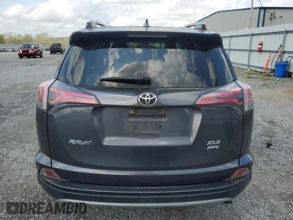 2018 Toyota RAV4 XLE with VIN JTMRFREV2JJ215776, listed as a Copart auction lot 51745205 with 52,009 mi miles and Salvage Title. Bid and sale history available at DreamBid. Image 6.