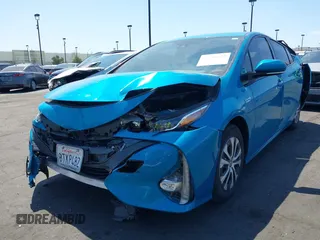 2021 Toyota Prius LE with VIN JTDKAMFP7M3169633, listed as a IAAI auction lot 41986170 with 55,925 mi miles and . Bid and sale history available at DreamBid. Image 18.