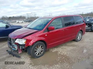 2014 Dodge Grand Caravan SE with VIN 2C4RDGBG6ER187868, listed as a IAAI auction lot 41949644 with 156,937 mi miles and . Bid and sale history available at DreamBid. Image 2.