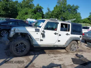 2016 Jeep Wrangler Unlimited Sport z VIN 1C4BJWDG5GL257423, wystawiony jako IAAI lot #42530026 z przebiegiem 157 072 mil mil oraz . Historia ofert i sprzedaży dostępna na DreamBid. Obrazek 14.