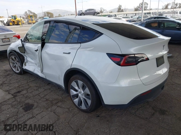 2023 Tesla Model Y Long Range with VIN 7SAYGAEE7PF607195, listed as a IAAI auction lot 41819147 with 74,694 mi miles. Bid and sale history available at carsss.com. Image 3.