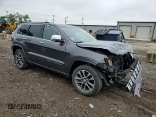 2017 Jeep Grand Cherokee Overland with VIN 1C4RJFCG8HC607872, listed as a Copart auction lot 57493195 with 164,478 mi miles and Salvage title. Bid and sale history available at DreamBid. Image 4.
