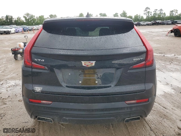 2023 Cadillac XT4 FWD Luxury with VIN 1GYAZAR45PF218684, listed as a Copart auction lot 54427565 with 74,920 mi miles and Salvage Title. Bid and sale history available at carsss.com. Image 6.