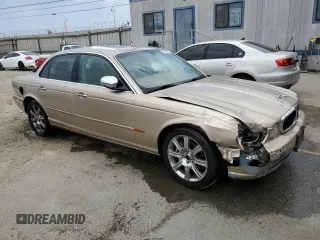 2004 Jaguar XJ with VIN SAJEA74C84SG03857, listed as a Copart auction lot 62156875 with 92,649 mi miles and Salvage title. Bid and sale history available at DreamBid. Image 4.