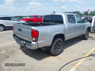 2023 Toyota Tacoma SR with VIN 3TYCZ5AN4PT149730, listed as a IAAI auction lot 42083146 with 31,731 mi miles and . Bid and sale history available at DreamBid. Image 4.