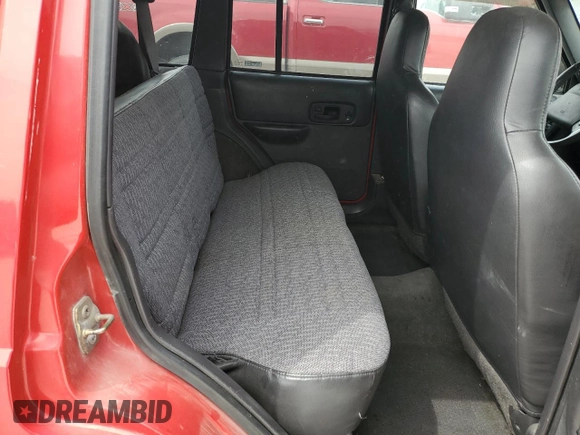 1999 Jeep Cherokee Sport with VIN 1J4FF68S3XL667570, listed as a Copart auction lot 52821105 with 173,712 mi miles and Salvage Title. Bid and sale history available at DreamBid. Image 10.