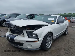 2007 Ford Mustang Shelby GT500 z VIN 1ZVHT88SX75317986, wystawiony jako IAAI lot #42310721 z przebiegiem 44 643 mil mil oraz . Historia ofert i sprzedaży dostępna na DreamBid. Obrazek 2.