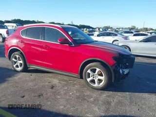 2018 Alfa Romeo Stelvio z VIN ZASFAKAN3J7C20066, wystawiony jako IAAI lot #40879859 z przebiegiem 50 131 mil mil oraz . Historia ofert i sprzedaży dostępna na DreamBid. Obrazek 1.