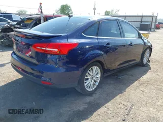 2017 Ford Focus Titanium with VIN 1FADP3J29HL204892, listed as a IAAI auction lot 42032705 with 119,028 mi miles and . Bid and sale history available at DreamBid. Image 4.