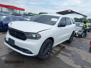 2019 Dodge Durango SXT Plus with VIN 1C4RDJAG3KC821124, listed as a IAAI auction lot 42214374 with 102,134 mi miles and . Bid and sale history available at DreamBid. Image 2.