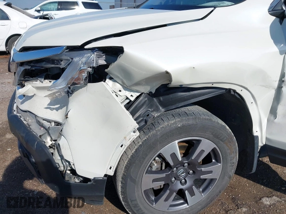 2017 Honda Ridgeline RTL-T z VIN 5FPYK3F69HB038048, wystawiony jako IAAI lot #42583177 z przebiegiem 183 564 mil mil oraz . Historia ofert i sprzedaży dostępna na DreamBid. Obrazek 6.