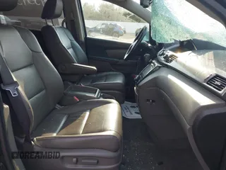 2015 Honda Odyssey EX-L z VIN 5FNRL5H60FB085047, wystawiony jako IAAI lot #42045345 z przebiegiem 180 323 mil mil oraz . Historia ofert i sprzedaży dostępna na DreamBid. Obrazek 5.