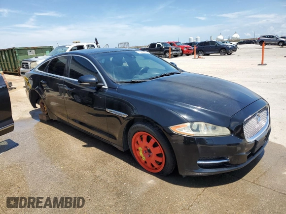 2011 Jaguar XJ with VIN SAJWA1CBXBLV12152, listed as a Copart auction lot 62010855 with 125,697 mi miles and Salvage title. Bid and sale history available at DreamBid. Image 4.