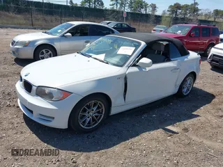 2010 BMW 1 Series 128i with VIN WBAUL7C53AVJ77801, listed as a IAAI auction lot 42048295 with 152,176 mi miles and . Bid and sale history available at carsss.com. Image 2.