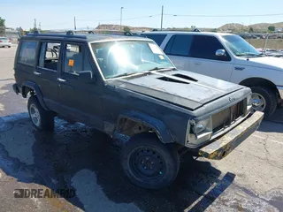 1995 Jeep Cherokee Sport with VIN 1J4FJ68S5SL541413, listed as a IAAI auction lot 42722408 with 335,432 mi miles and . Bid and sale history available at DreamBid. Image 1.