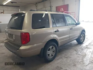 2005 Honda Pilot EX-L with VIN 5FNYF18565B019345, listed as a IAAI auction lot 41641423 with 282,099 mi miles. Bid and sale history available at carsss.com. Image 4.