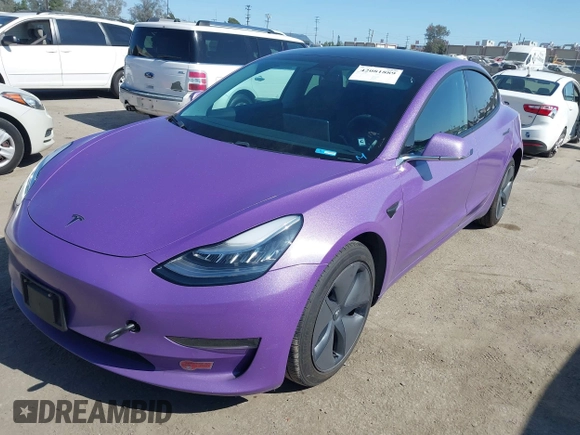 2020 Tesla Model 3 Standard Range Plus with VIN 5YJ3E1EA0LF739462, listed as a IAAI auction lot 42081889 with 65,254 mi miles. Bid and sale history available at carsss.com. Image 2.
