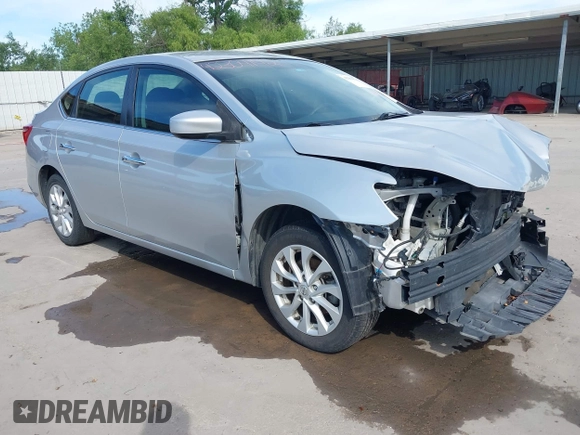 2019 Nissan Sentra SV z VIN 3N1AB7AP1KL604264, wystawiony jako IAAI lot #42304142 z przebiegiem 87 506 mil mil oraz . Historia ofert i sprzedaży dostępna na DreamBid. Obrazek 1.