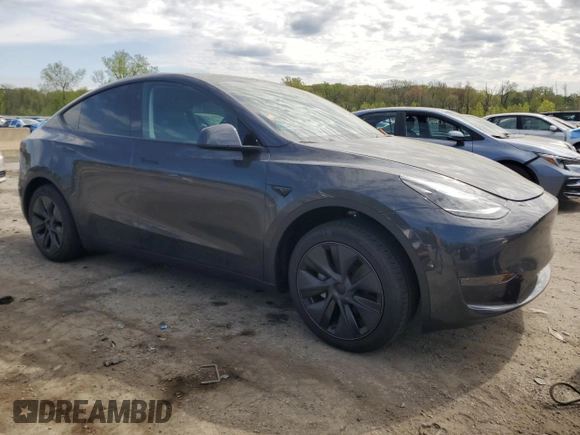 2025 Tesla Model Y Long Range with VIN 7SAYGDED7SF320702, listed as a Copart auction lot 54655325 with 1,169 mi miles and Salvage Title. Bid and sale history available at DreamBid. Image 4.