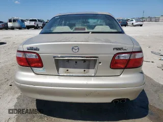 2000 Mazda Millenia with VIN JM1TA2210Y1614967, listed as a Copart auction lot 53606185 with 120,288 mi miles and Salvage Title. Bid and sale history available at DreamBid. Image 6.