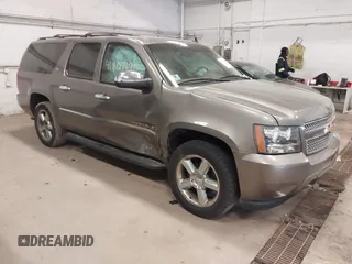 2012 Chevrolet Suburban LTZ with VIN 1GNSKKE79CR180400, listed as a IAAI auction lot 41807195 with 154,410 mi miles. Bid and sale history available at carsss.com. Image 1.