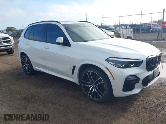 2021 BMW X5 sDrive40i with VIN 5UXCR4C00M9D80482, listed as a IAAI auction lot 41636009 with 85,103 mi miles. Bid and sale history available at carsss.com. Image 1.
