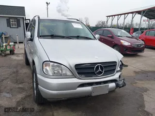 1999 Mercedes-Benz M-Class with VIN 4JGAB72E4XA113675, listed as a IAAI auction lot 41554604 with 230,092 mi miles. Bid and sale history available at carsss.com. Image 12.
