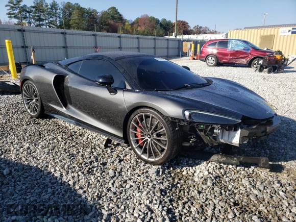 2021 McLaren GT z VIN SBM22GCA8MW001374, wystawiony jako Copart lot #82147064 z przebiegiem 32 562 mil mil oraz Nie do naprawy. Historia ofert i sprzedaży dostępna na DreamBid. Obrazek 4.