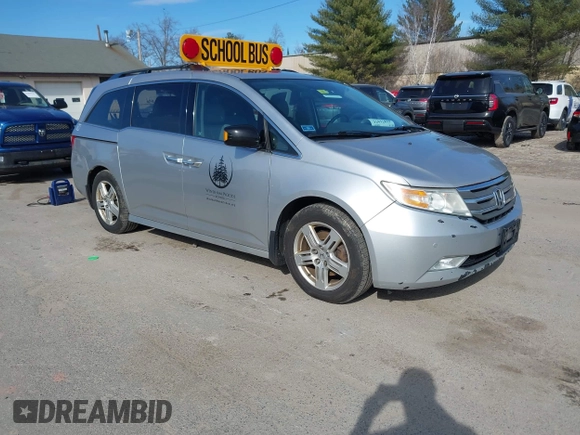 2012 Honda Odyssey Touring with VIN 5FNRL5H95CB063003, listed as a IAAI auction lot 41871975 with 179,332 mi miles and . Bid and sale history available at DreamBid. Image 1.
