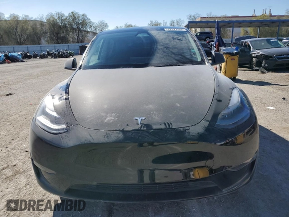 2023 Tesla Model Y Performance with VIN 7SAYGDEF7PF924355, listed as a Copart auction lot 47877055 with 64,663 mi miles and Salvage Title. Bid and sale history available at DreamBid. Image 5.
