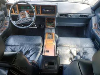 1988 Cadillac Eldorado z VIN 1G6EL1155JU600524, wystawiony jako Copart lot #59505125 z przebiegiem 110 972 mil mil oraz Szkoda całkowita • Salvage title. Historia ofert i sprzedaży dostępna na DreamBid. Obrazek 8.