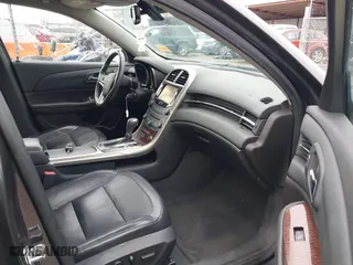 2013 Chevrolet Malibu LTZ with VIN 1G11H5SA4DF284325, listed as a IAAI auction lot 41719231 with 168,300 mi miles. Bid and sale history available at carsss.com. Image 5.