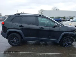 2016 Jeep Cherokee Trailhawk with VIN 1C4PJMBS5GW304062, listed as a IAAI auction lot 41756813 with 112,671 mi miles. Bid and sale history available at carsss.com. Image 14.