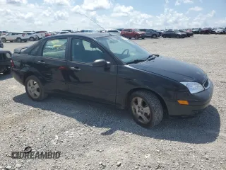 2006 Ford Focus S with VIN 1FAFP34N76W246035, listed as a Copart auction lot 61985015 with 196,498 mi miles and Salvage title. Bid and sale history available at DreamBid. Image 4.