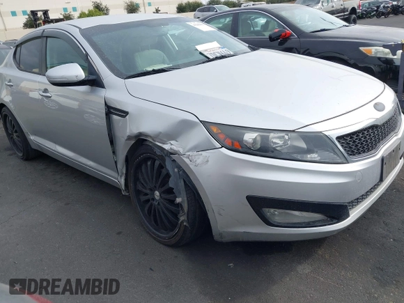 2013 Kia Optima LX with VIN KNAGM4A75D5430974, listed as a IAAI auction lot 41209055 with 197,871 mi miles. Bid and sale history available at carsss.com. Image 1.