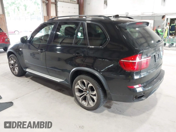 2012 BMW X5 50i with VIN 5UXZV8C50CL425721, listed as a IAAI auction lot 42590676 with 192,355 mi miles and . Bid and sale history available at DreamBid. Image 3.