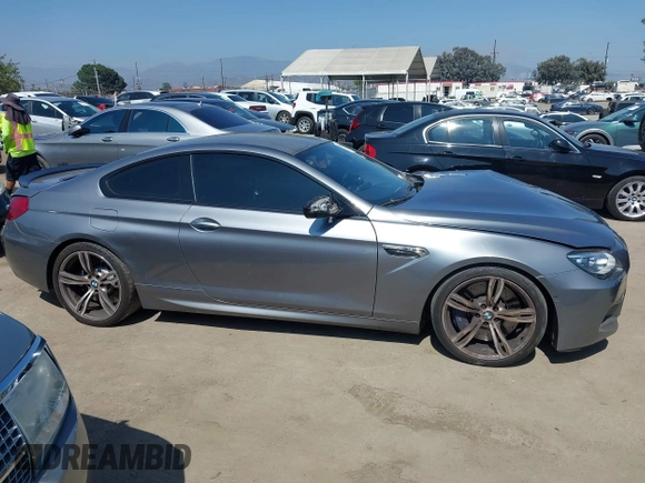 2013 BMW M6 with VIN WBSLX9C51DC968593, listed as a IAAI auction lot 42465979 with 88,010 mi miles and . Bid and sale history available at DreamBid. Image 13.