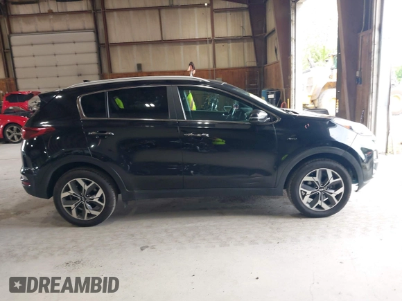 2021 Kia Sportage EX z VIN KNDPNCAC5M7886551, wystawiony jako IAAI lot #42645206 z przebiegiem 49 312 mil mil oraz . Historia ofert i sprzedaży dostępna na DreamBid. Obrazek 13.
