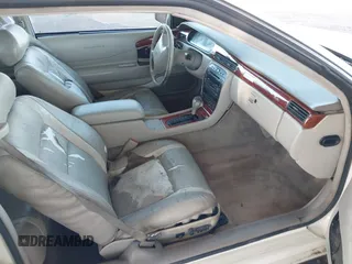 2002 Cadillac Eldorado z VIN 1G6EC12922B106670, wystawiony jako IAAI lot #41648782 z przebiegiem 174 320 mil mil oraz . Historia ofert i sprzedaży dostępna na DreamBid. Obrazek 5.