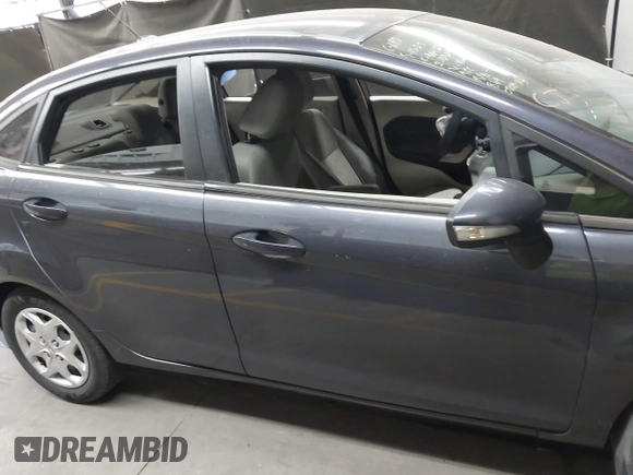 2013 Ford Fiesta SE z VIN 3FADP4BJ1DM186232, wystawiony jako IAAI lot #42304613 z przebiegiem 105 919 mil mil oraz . Historia ofert i sprzedaży dostępna na DreamBid. Obrazek 13.