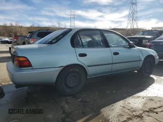 1994 Toyota Corolla Deluxe with VIN JT2AE09B4R0067104, listed as a Copart auction lot 83565064 with 207,923 mi miles and Salvage title. Bid and sale history available at DreamBid. Image 3.