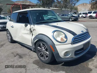 2011 MINI Hardtop with VIN WMWSU3C53BTX97140, listed as a IAAI auction lot 41861648 with 111,899 mi miles and . Bid and sale history available at DreamBid. Image 1.