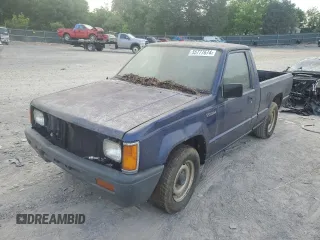 1995 Mitsubishi Mighty Max z VIN JA7LS21G4SP002839, wystawiony jako Copart lot #55777674 z przebiegiem Nie podano mil oraz Tytuł czysty. Historia ofert i sprzedaży dostępna na DreamBid. Obrazek 1.