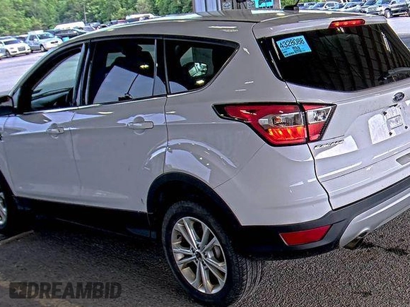 2017 Ford Escape SE z VIN 1FMCU9GD0HUD44281, wystawiony jako IAAI lot #42573170 z przebiegiem 99 085 mil mil oraz . Historia ofert i sprzedaży dostępna na DreamBid. Obrazek 10.