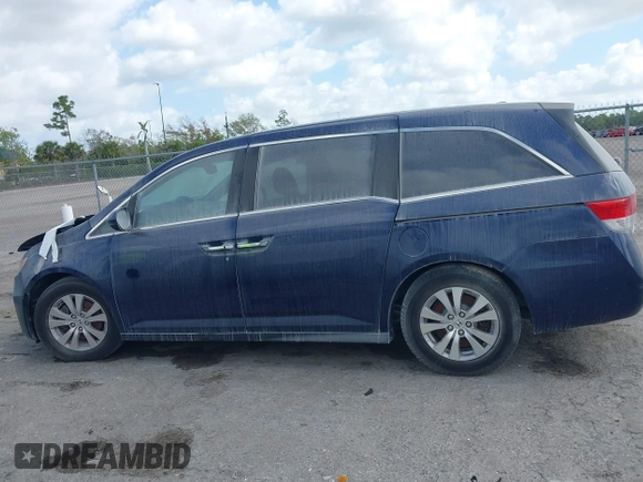 2015 Honda Odyssey EX-L z VIN 5FNRL5H65FB090177, wystawiony jako IAAI lot #41575419 z przebiegiem 128 582 mil mil oraz . Historia ofert i sprzedaży dostępna na DreamBid. Obrazek 14.