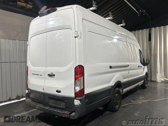 2020 Ford Transit Cargo with VIN 1FTBW3X85LKB80928, listed as a IAAI auction lot 42729884 with 70,670 mi miles and . Bid and sale history available at DreamBid. Image 3.