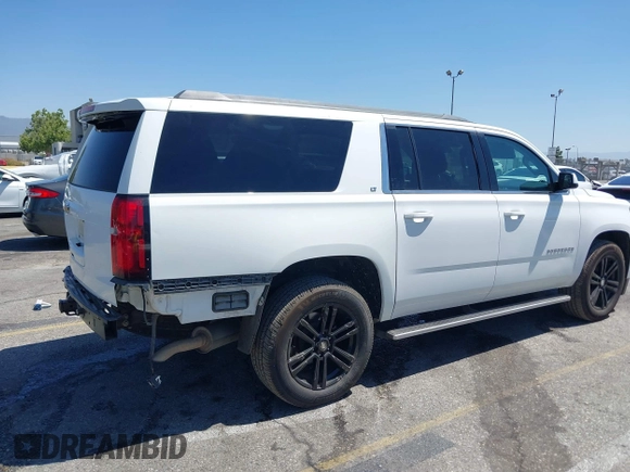 2017 Chevrolet Suburban LT z VIN 1GNSKHKC7HR325641, wystawiony jako IAAI lot #42290768 z przebiegiem 91 802 mil mil oraz . Historia ofert i sprzedaży dostępna na DreamBid. Obrazek 4.